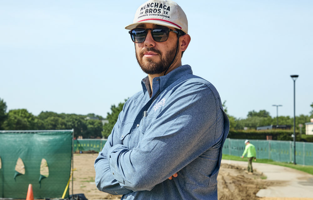 A man, Nathan Menchaca, in a blue button-up shirt.